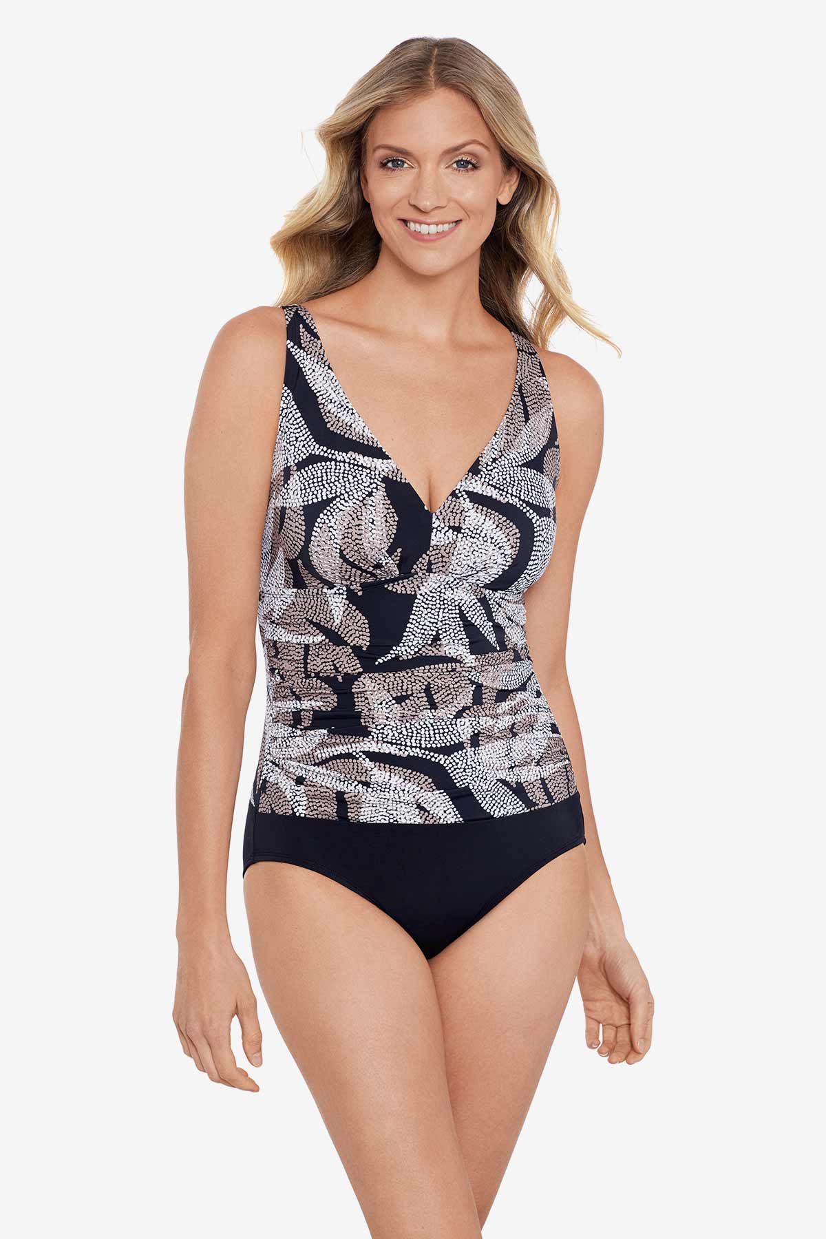 Woman wearing a dotted leaf pattern one-piece swimsuit