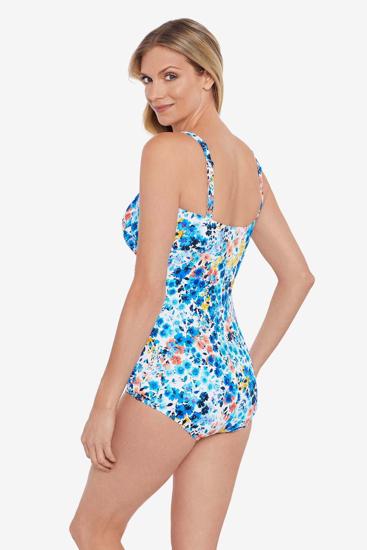 Woman turned left wearing a multicolored small floral printed one-piece swimsuit