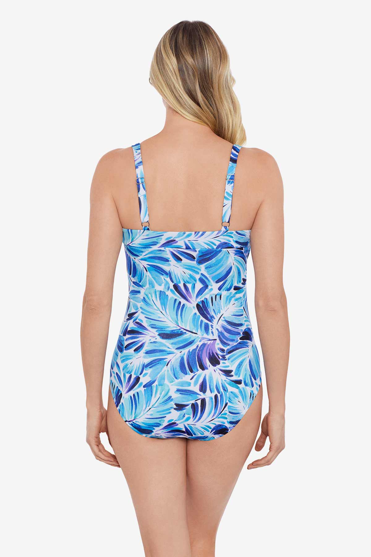 Woman faced away wearing a blue and white feather/leaf pattern one-piece swimsuit