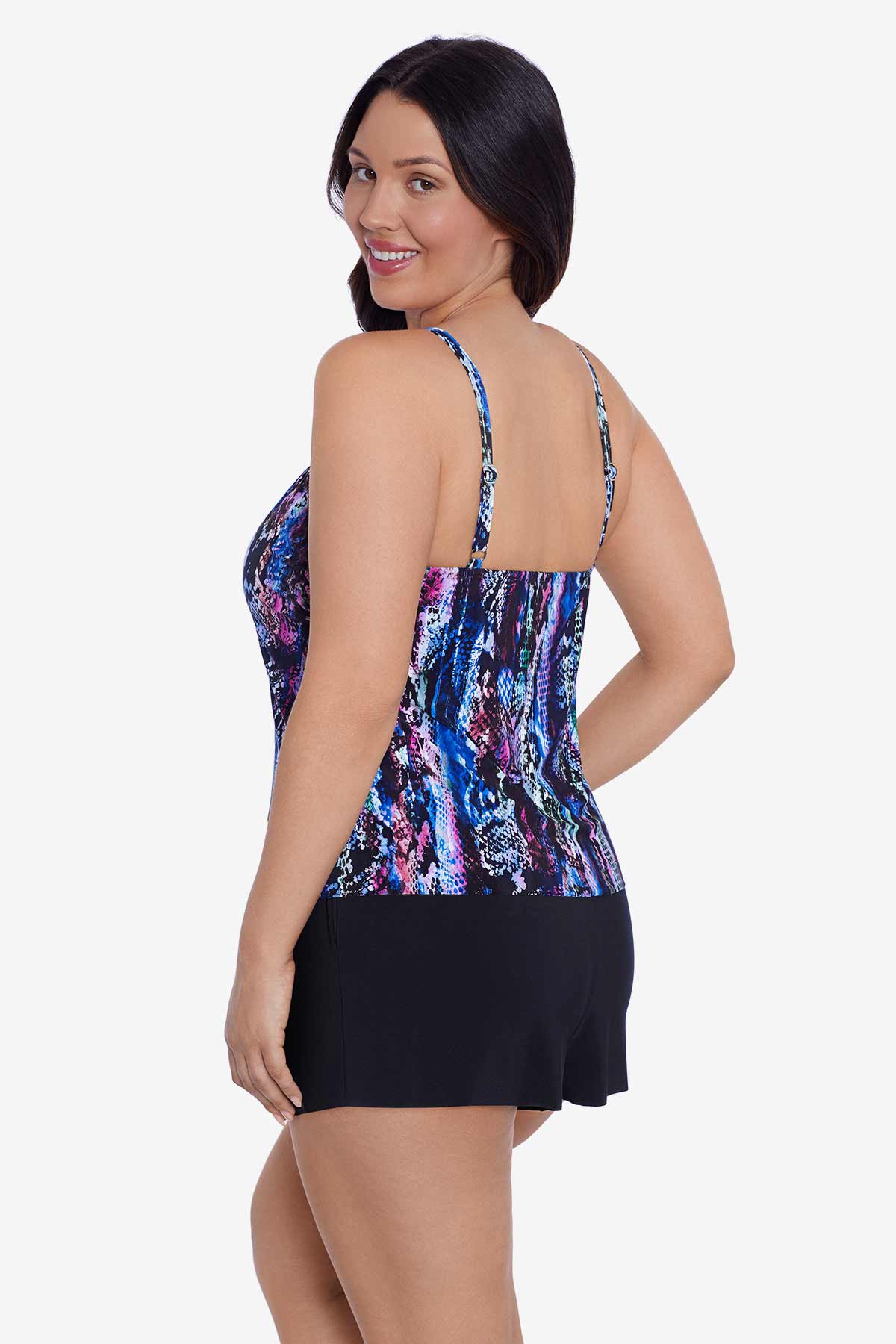 Woman turned left wearing an abstract snakeskin printed swim romper