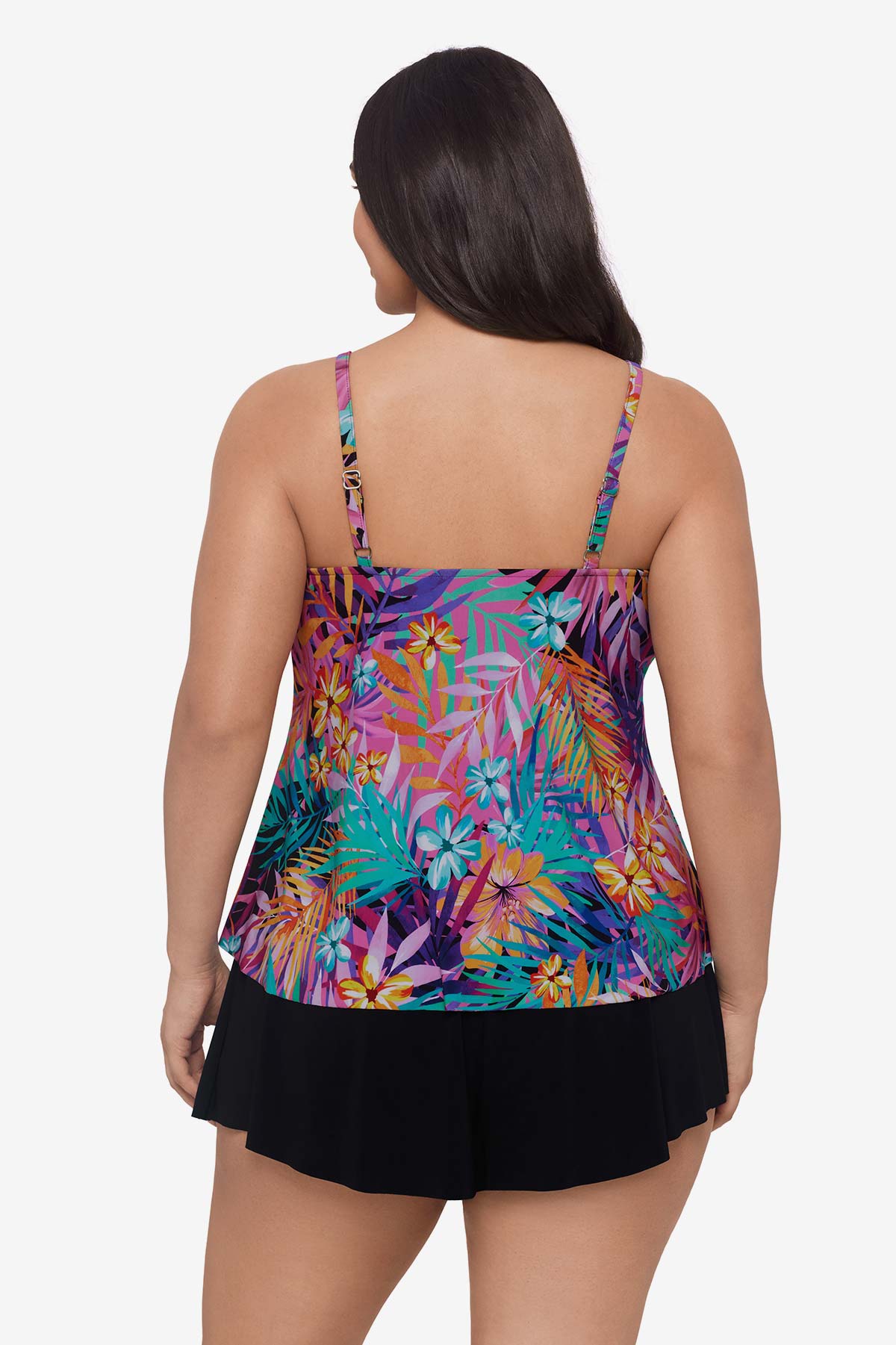 Woman faced away wearing a multicolored palm leaf printed tankini top