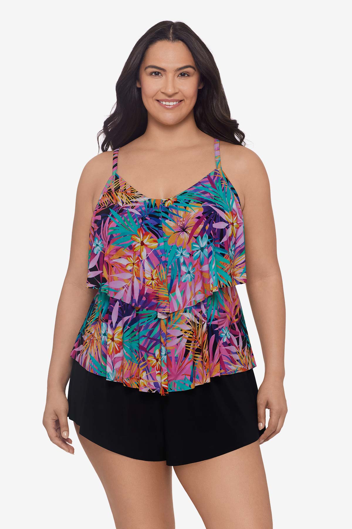 Woman wearing a multicolored palm leaf printed tankini top