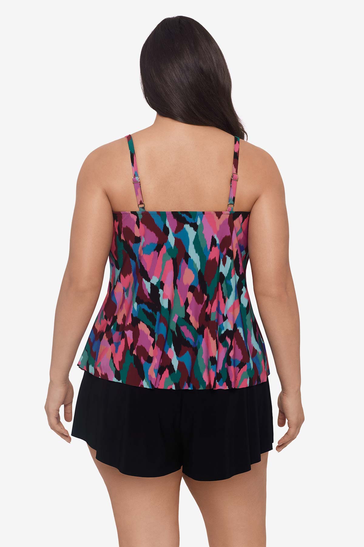 Woman faced away wearing a multicolored abstract collage printed tankini top