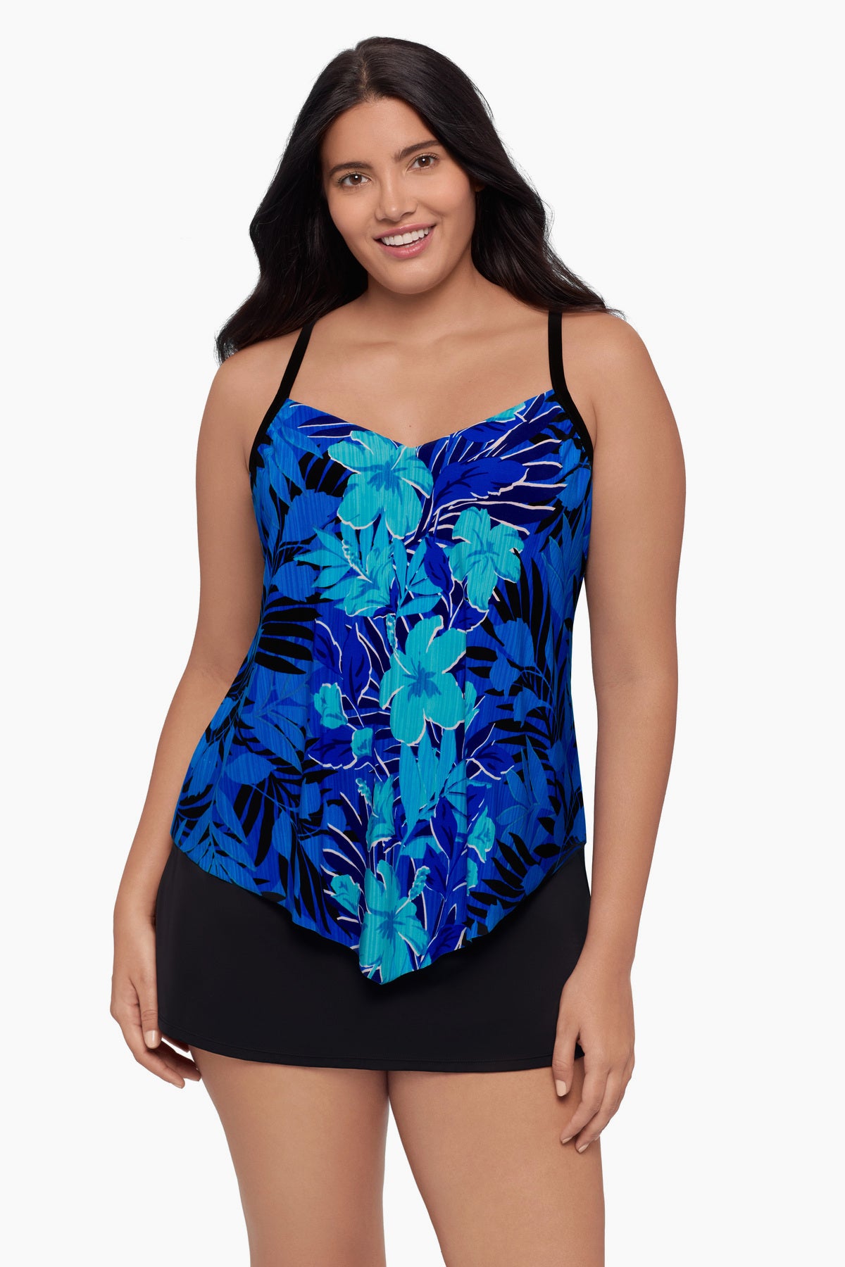 Woman wearing a tankini top with a blue floral pattern