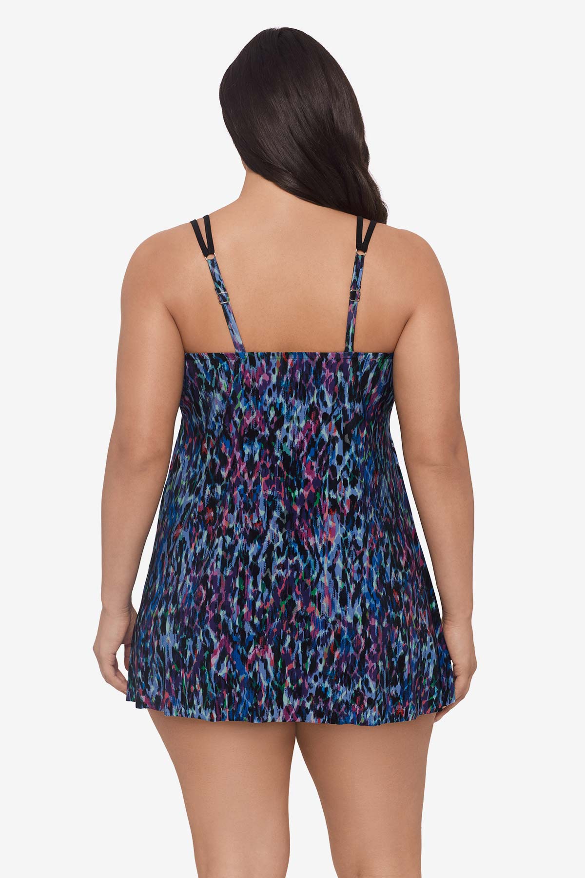 Woman faced away wearing a blue and purple abstract printed swim dress