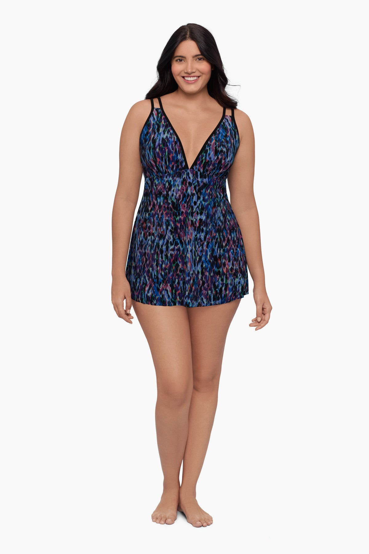 Woman wearing a swim dress with a blue abstract pattern