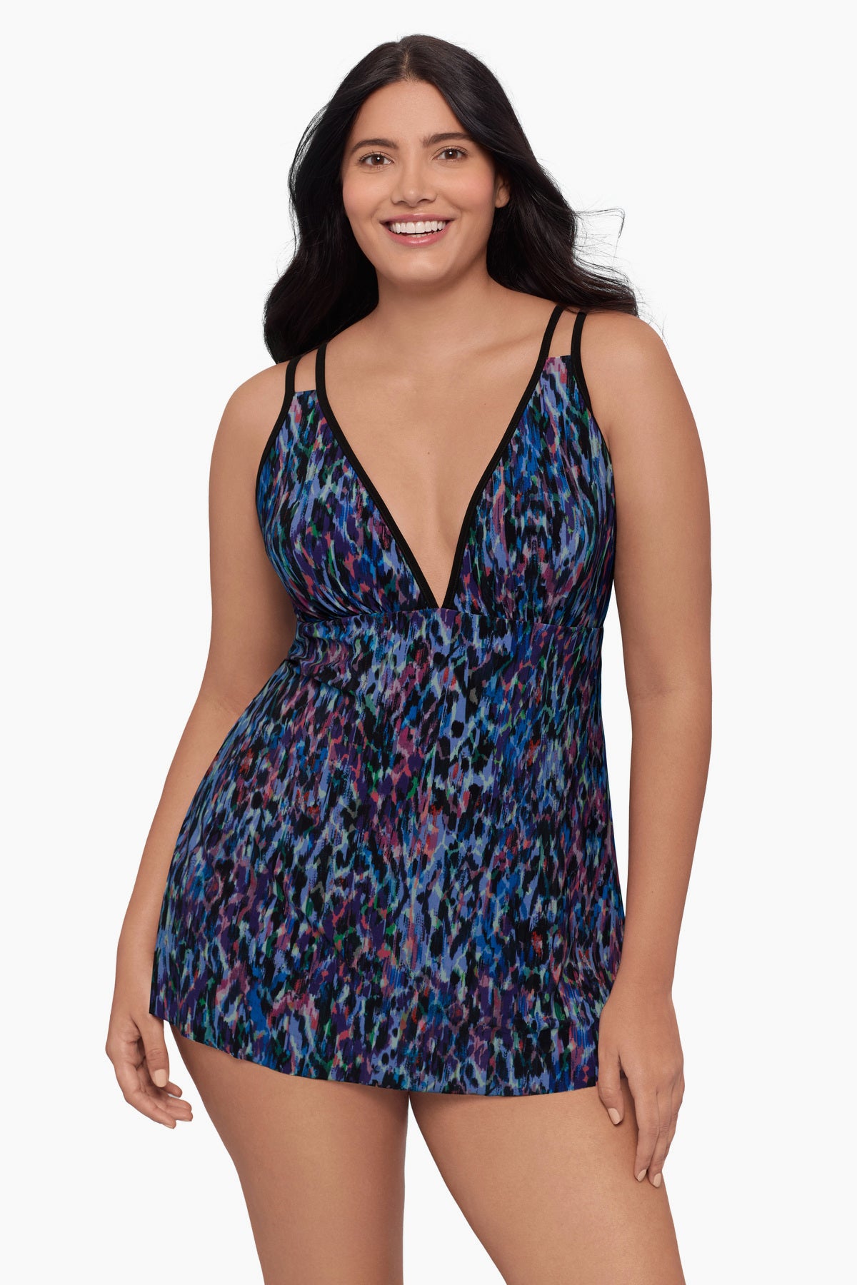 Woman wearing a swim dress with a blue abstract pattern