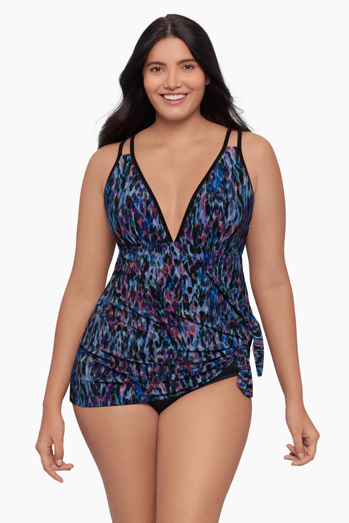 Woman wearing a swim dress with a blue abstract pattern