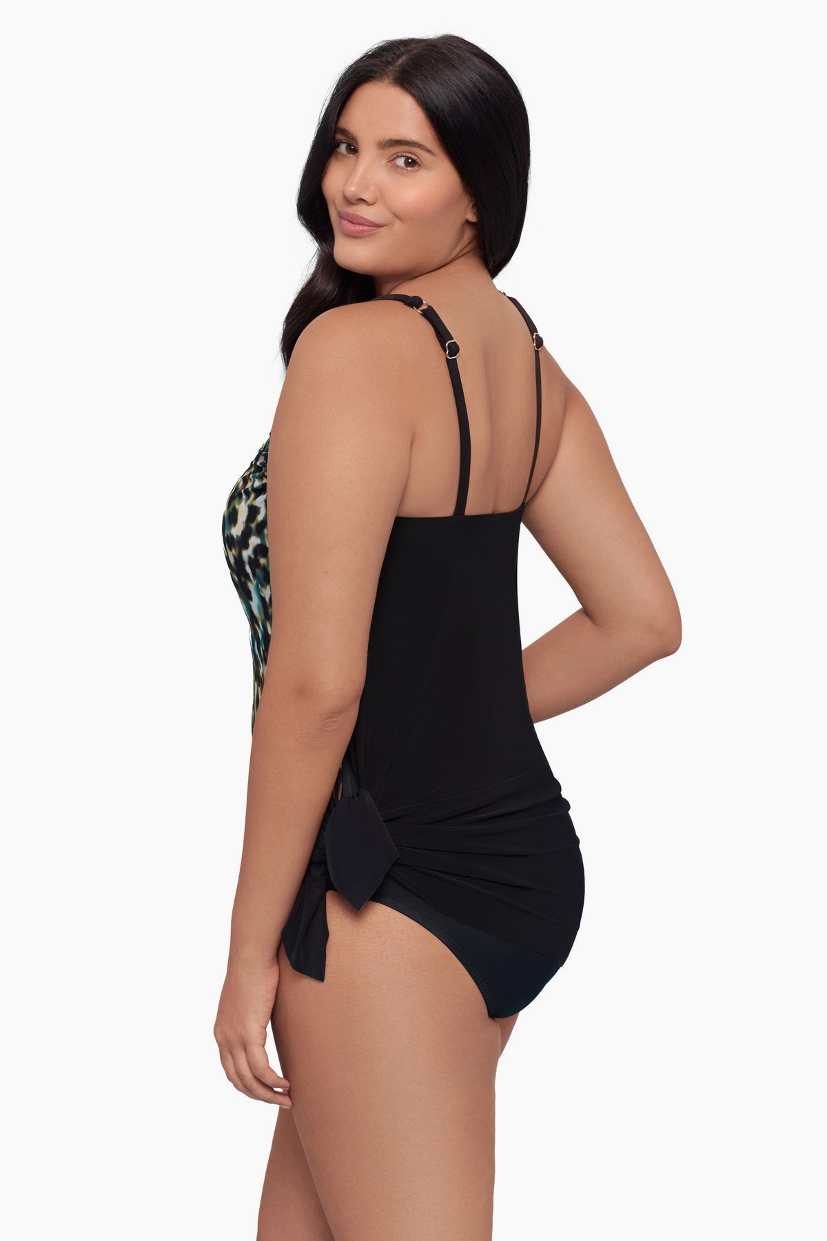 Woman turned left wearing a swim dress with an ombre leopard print