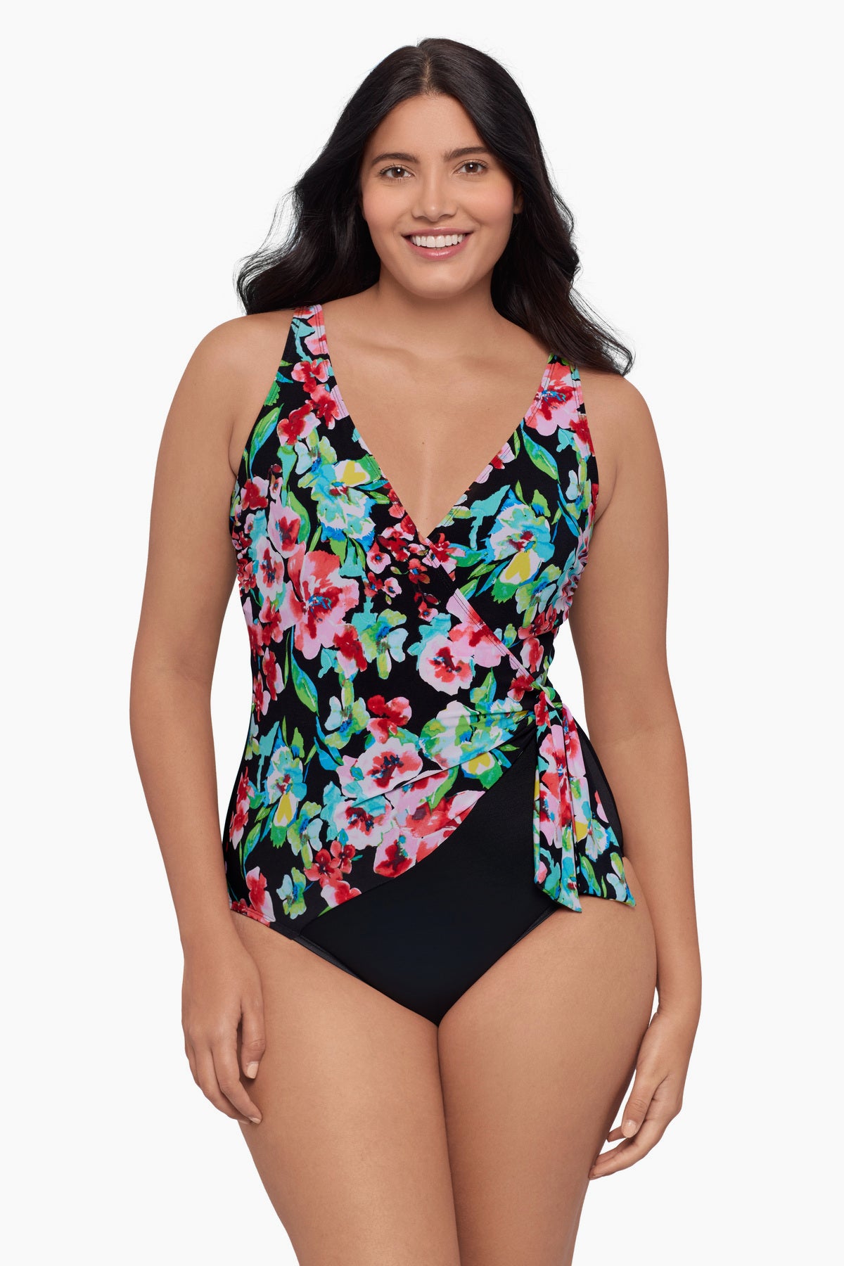 Woman wearing a one-piece swimsuit with a floral print
