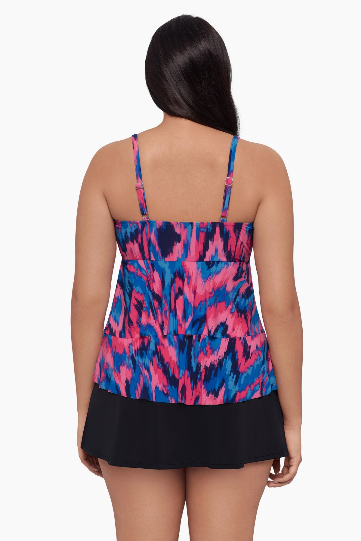 Woman turned away wearing a tankini top with a pink and blue print