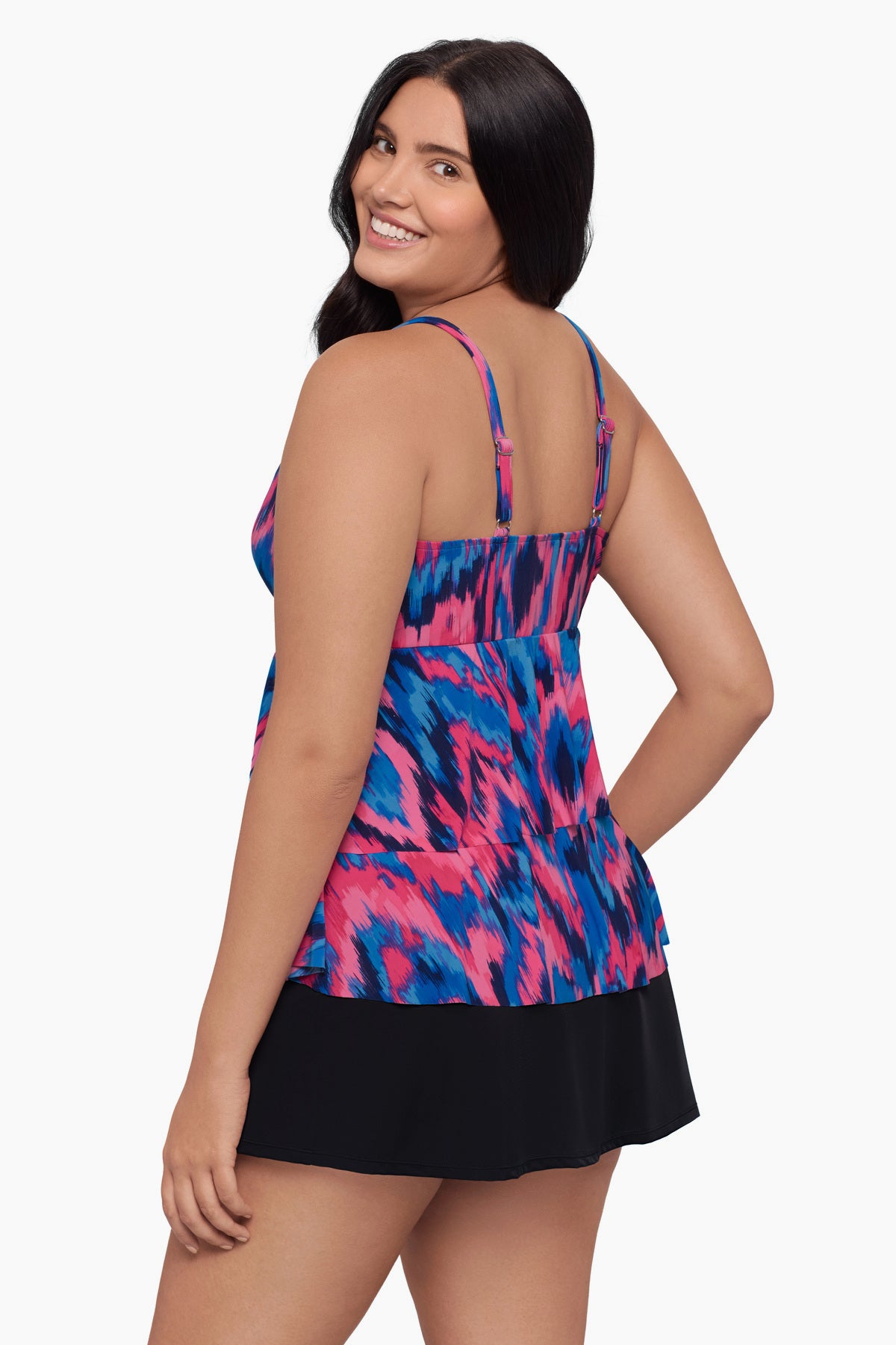 Woman turned left wearing a tankini top with a pink and blue print
