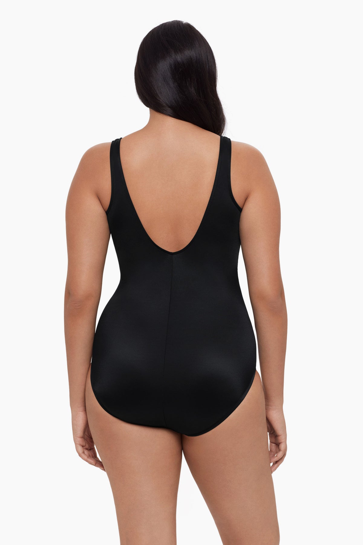 Woman turned away wearing a one-piece swimsuit