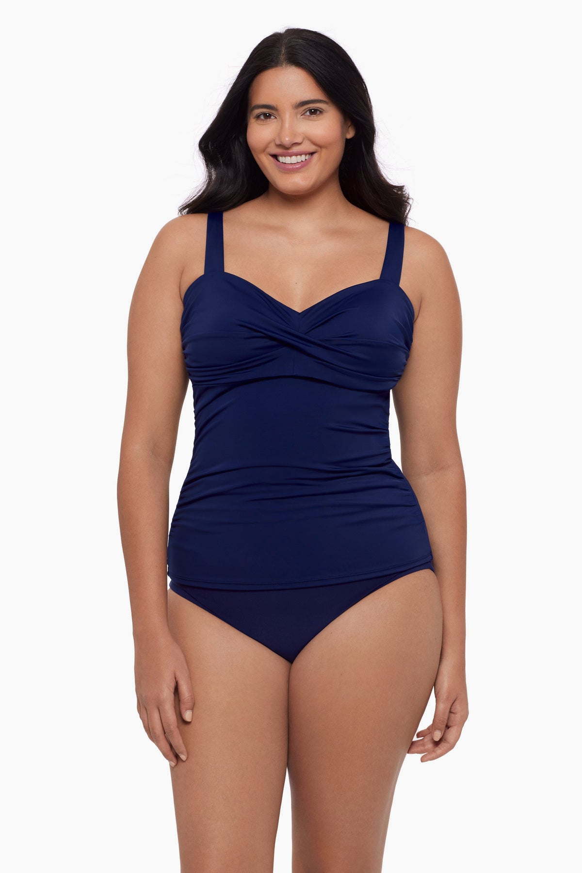 Woman wearing a tankini top in ink blue