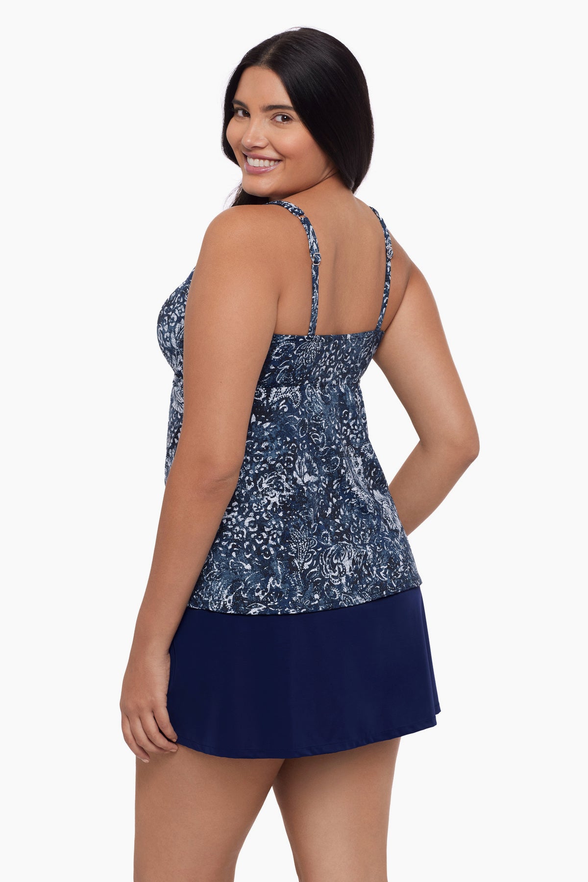 Woman turned left wearing a tankini top with a paisley-esque print