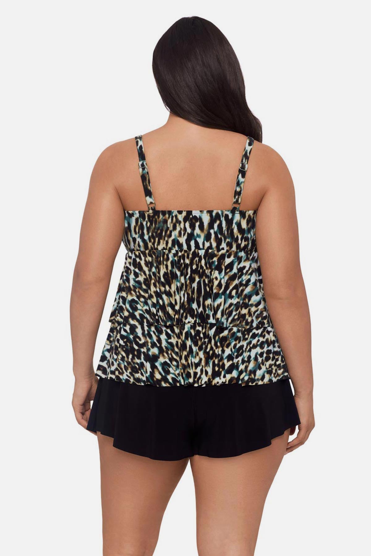Woman turned away wearing animal print tankini top with ruffles