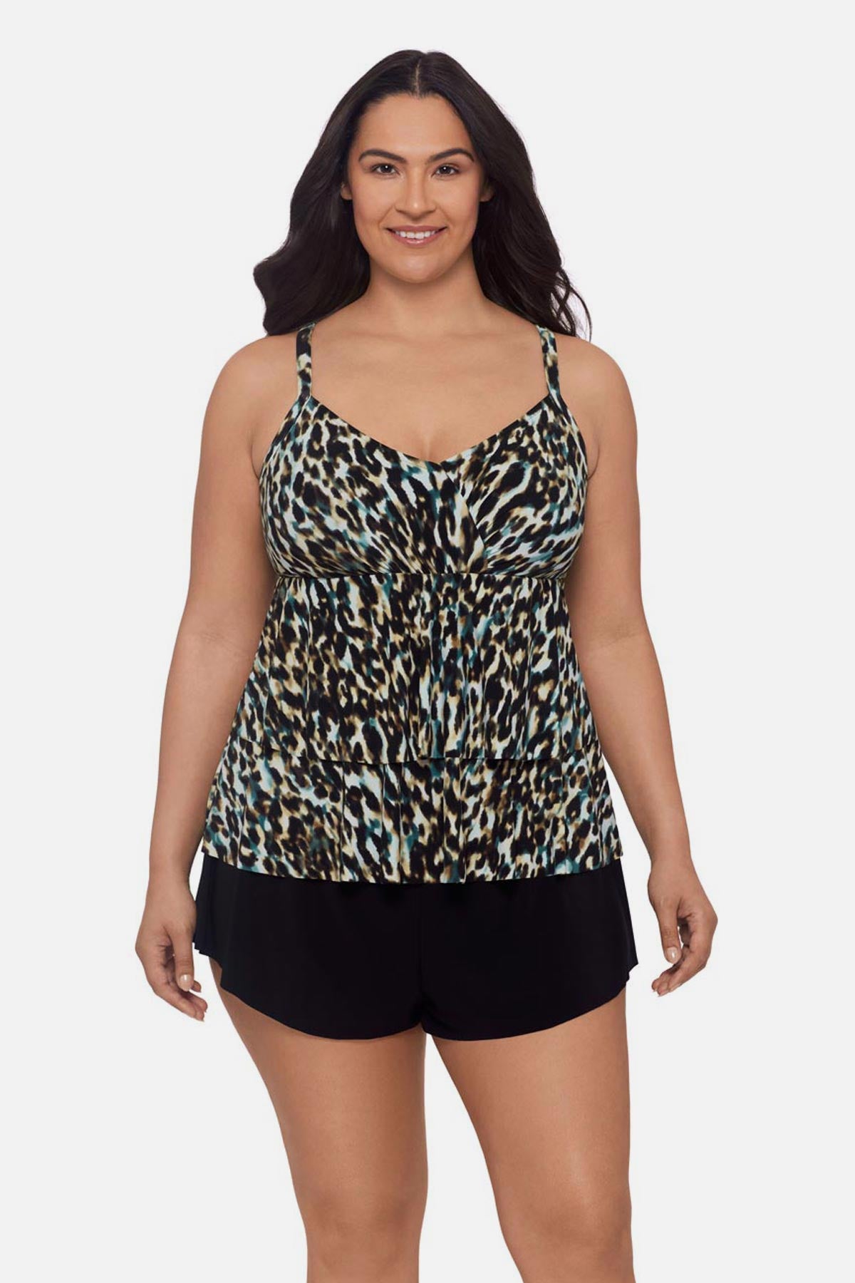 Woman wearing animal print tankini top with ruffles