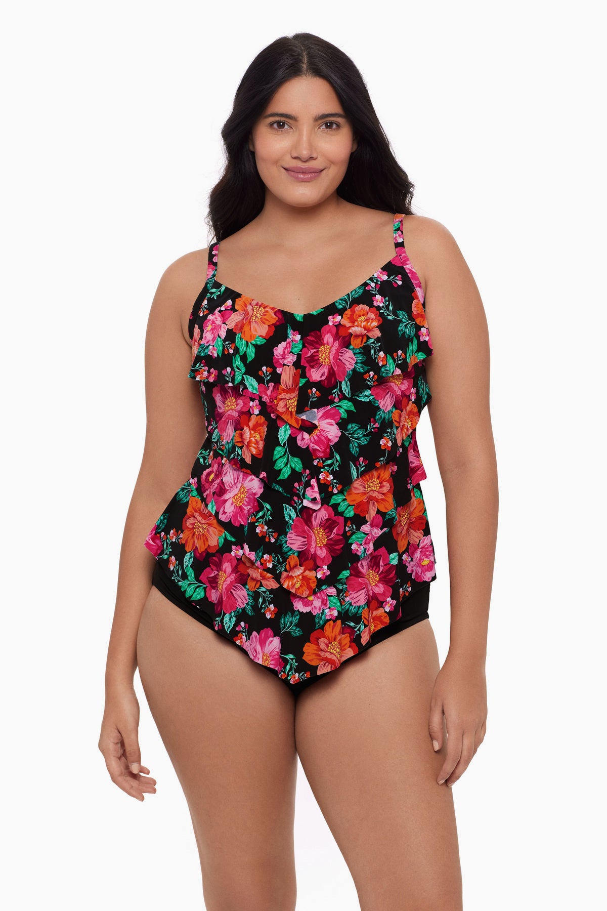 Woman wearing a tiered tankini top with a red and pink floral pattern