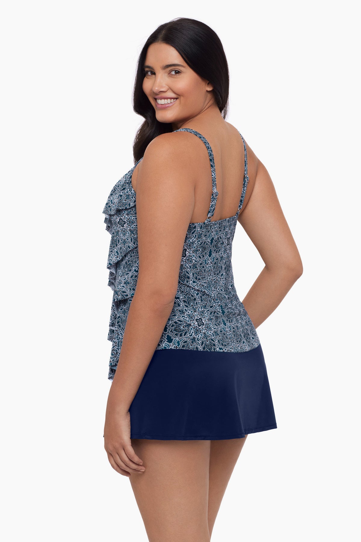 Woman turned left wearing a tankini top with a blue tile print