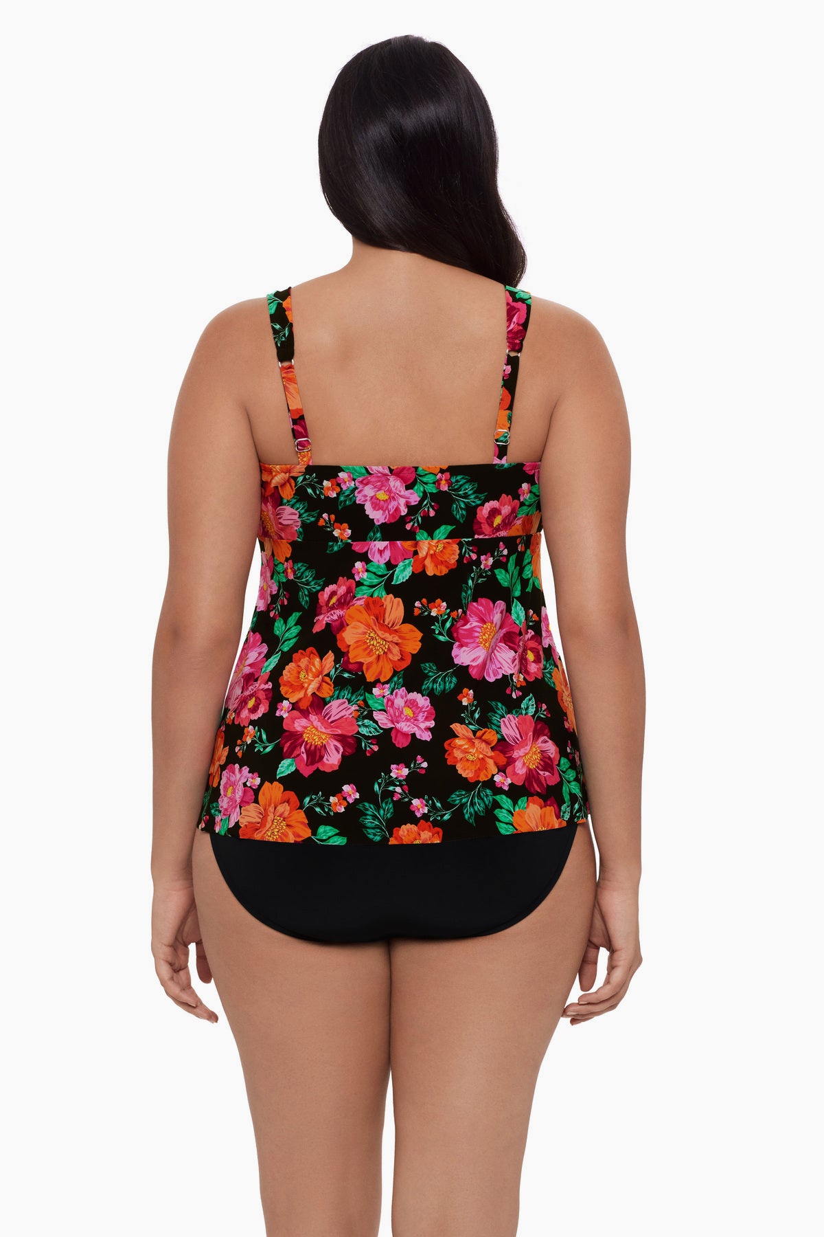 Woman turned away wearing a red and pink floral printed tankini top