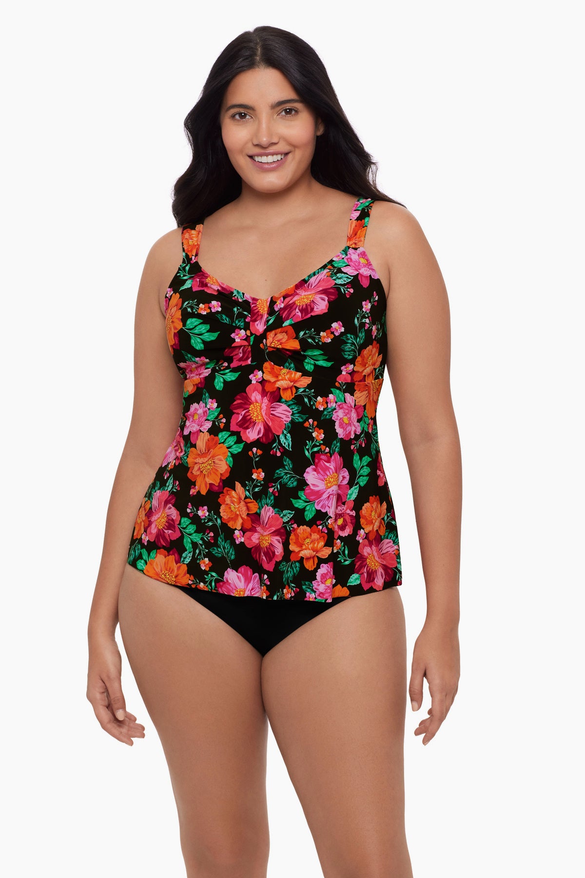 Woman wearing a red and pink floral printed tankini top