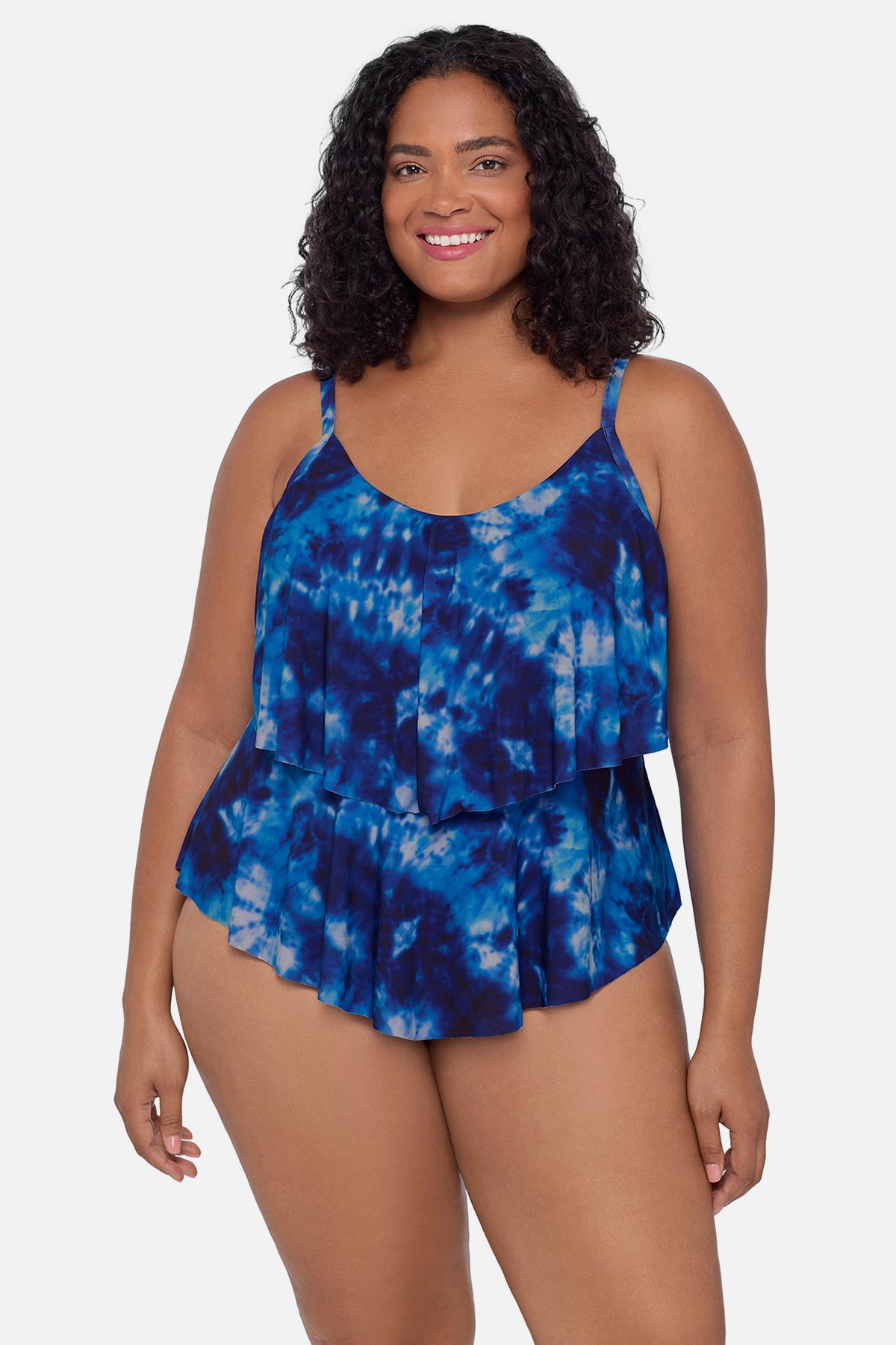 Woman wearing a blue tie dye tankini top with ruffles