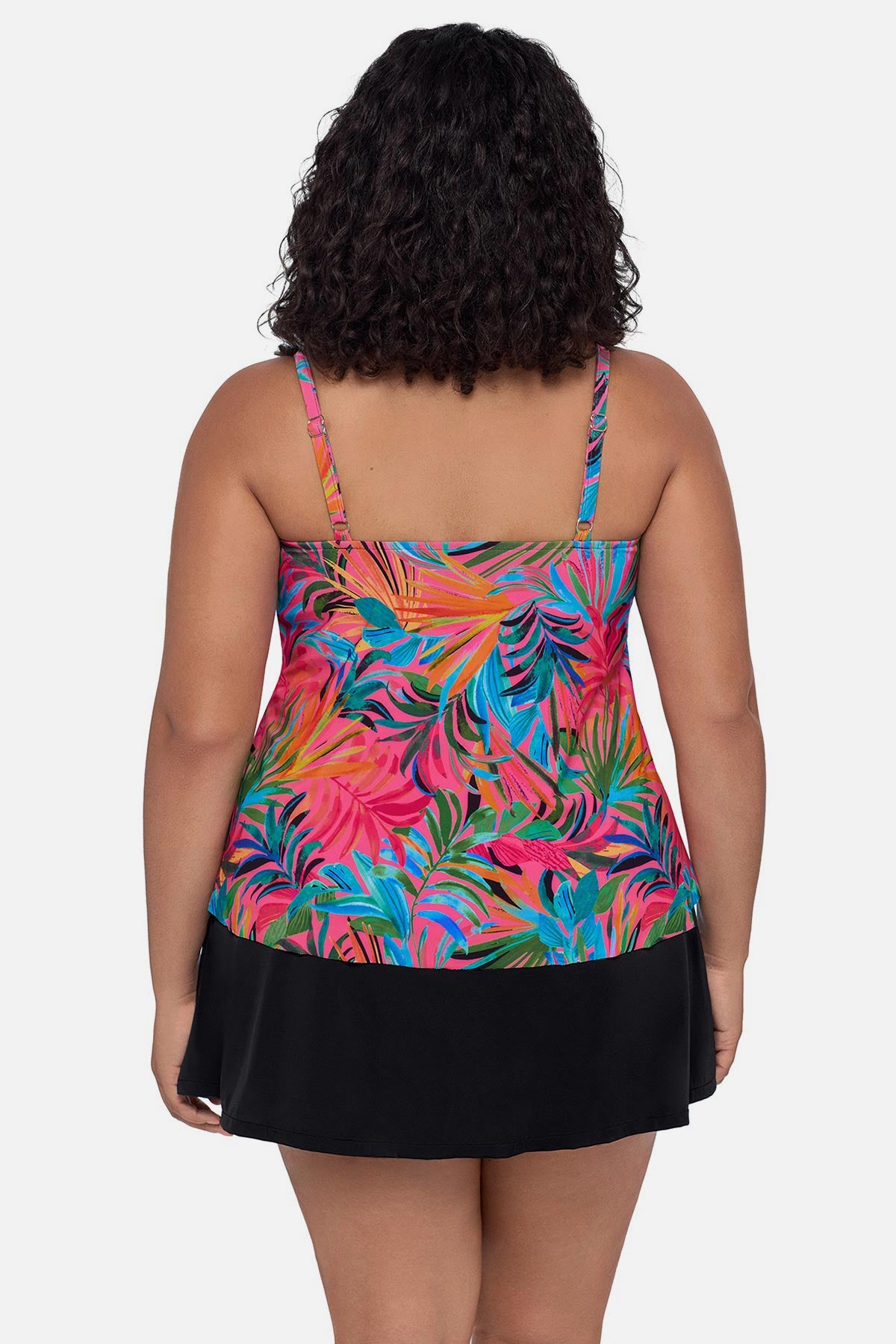 Woman turned away wearing a multicolored palm leaf printed tankini top