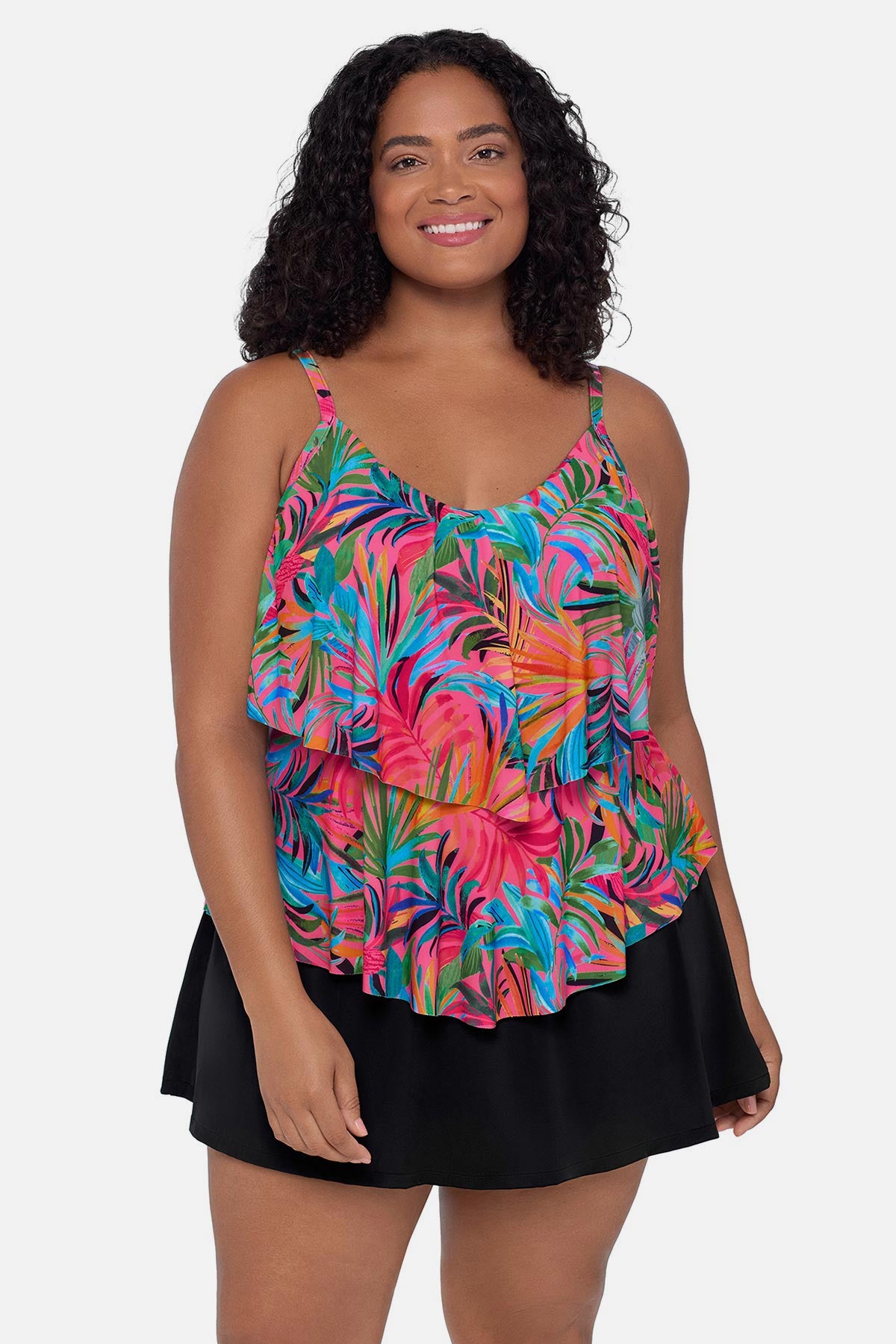 Woman wearing a multicolored palm leaf printed tankini top with ruffles