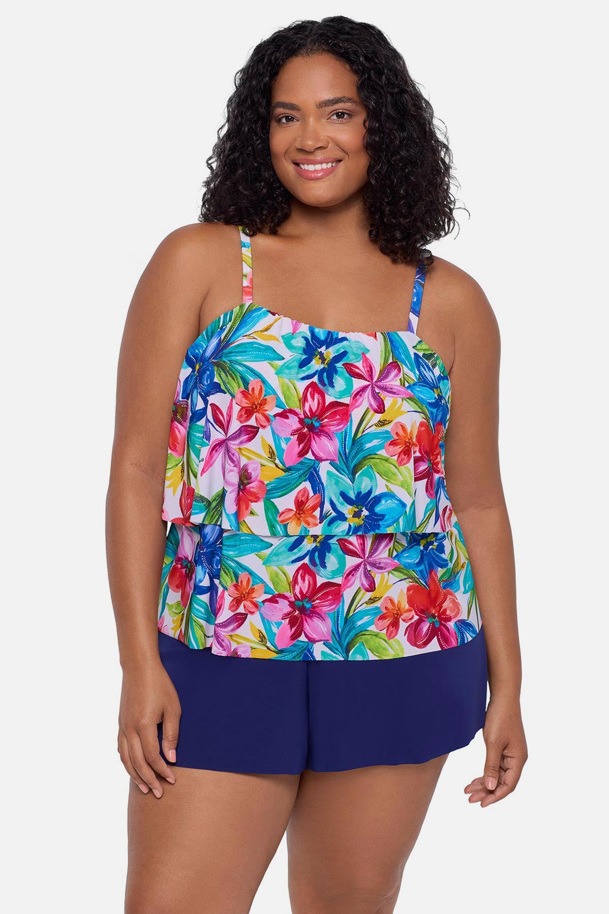 Woman wearing a multicolored floral printed swim romper with ruffles