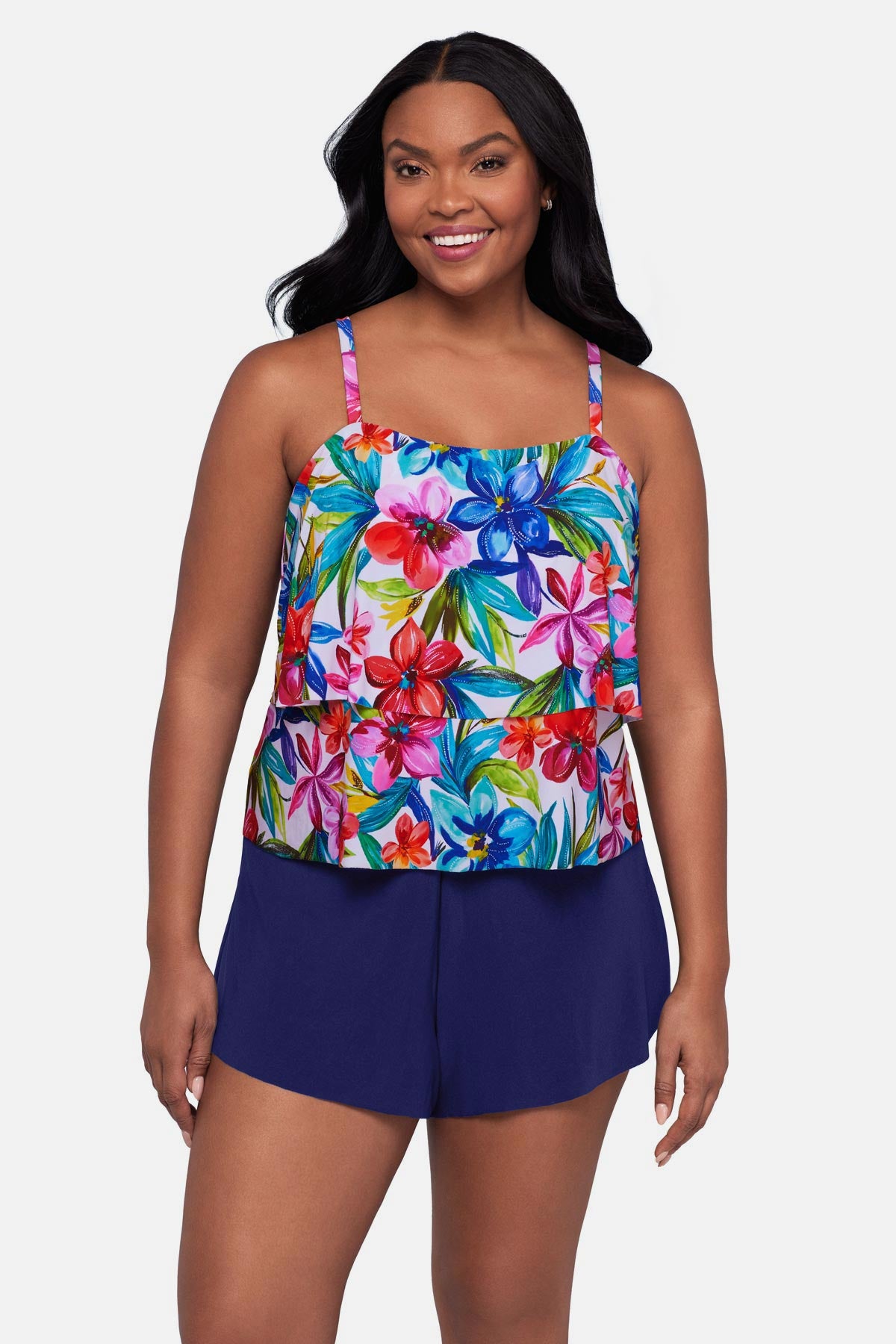 Woman wearing a multicolored floral printed swim romper with ruffles