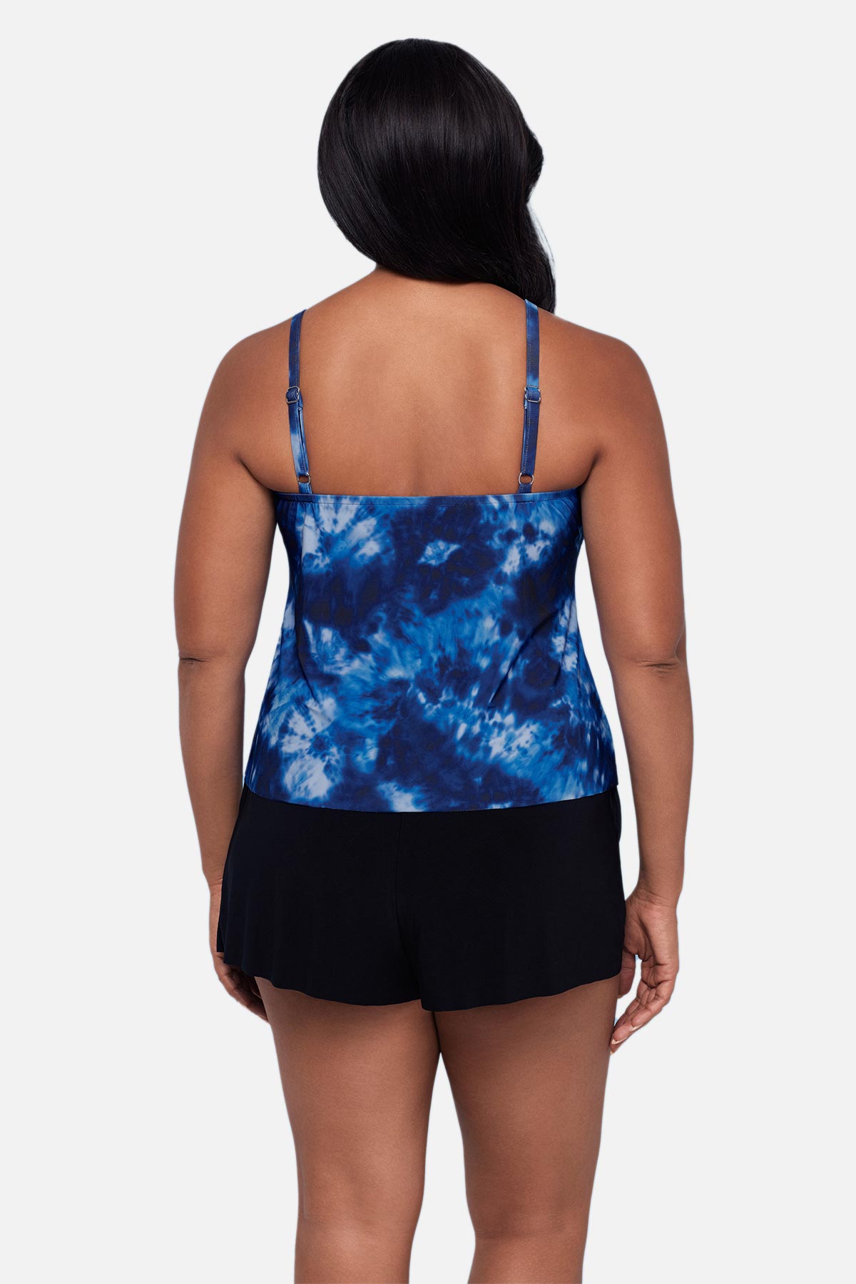 Woman turned away wearing a blue tie dye swim romper