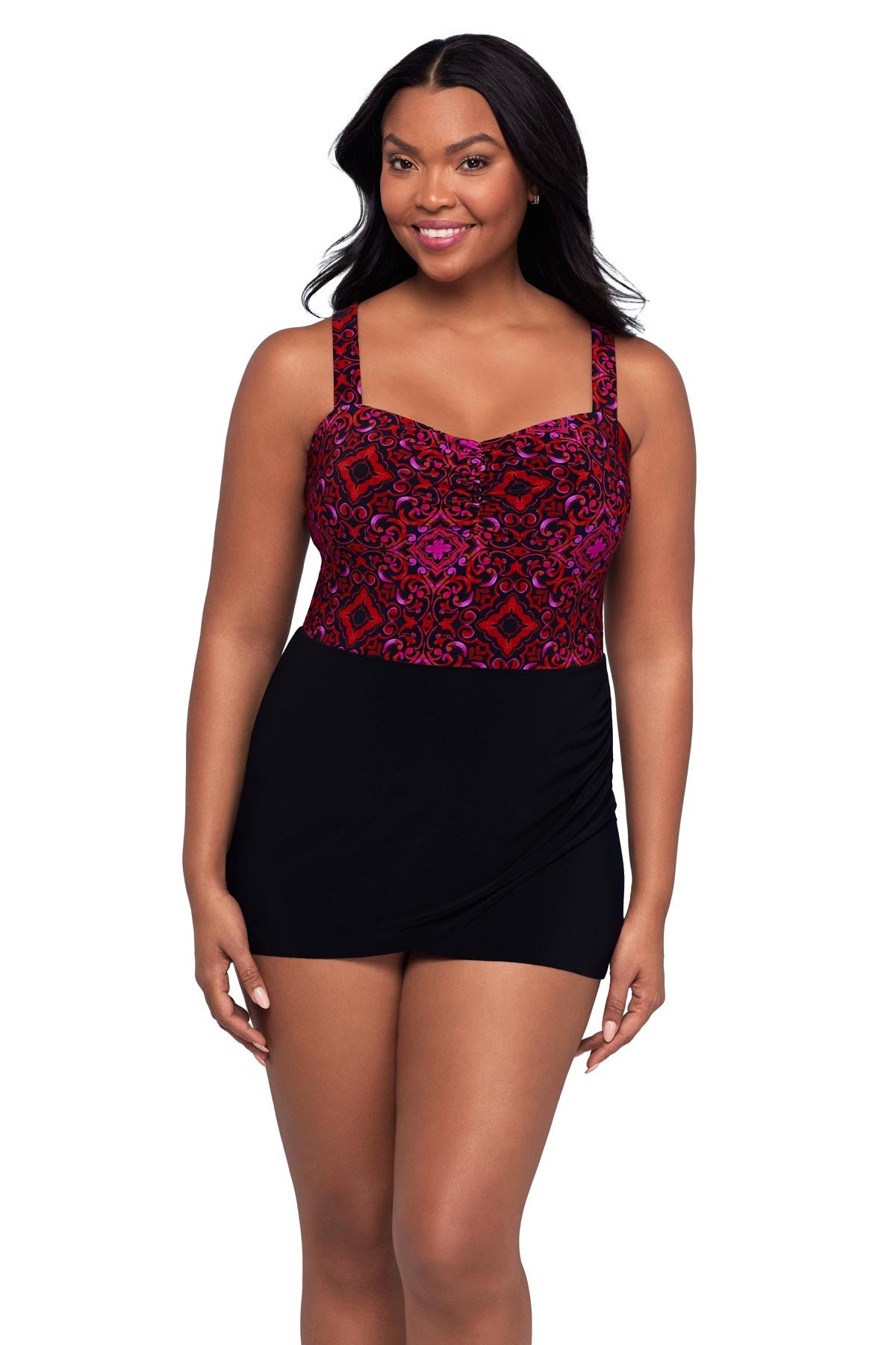 Woman wearing a red and purple tile pattern swim dress