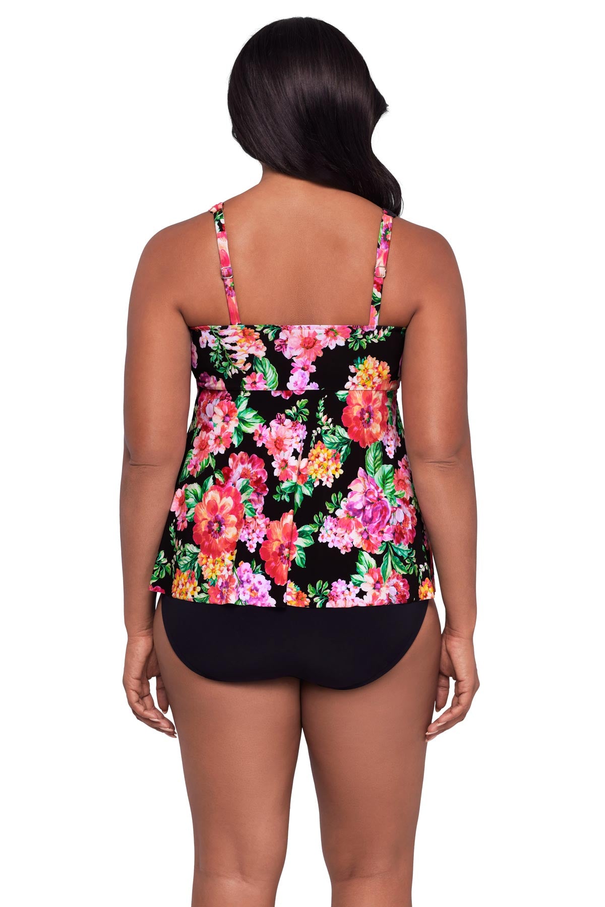 Woman turned away wearing a pink floral print tankini top