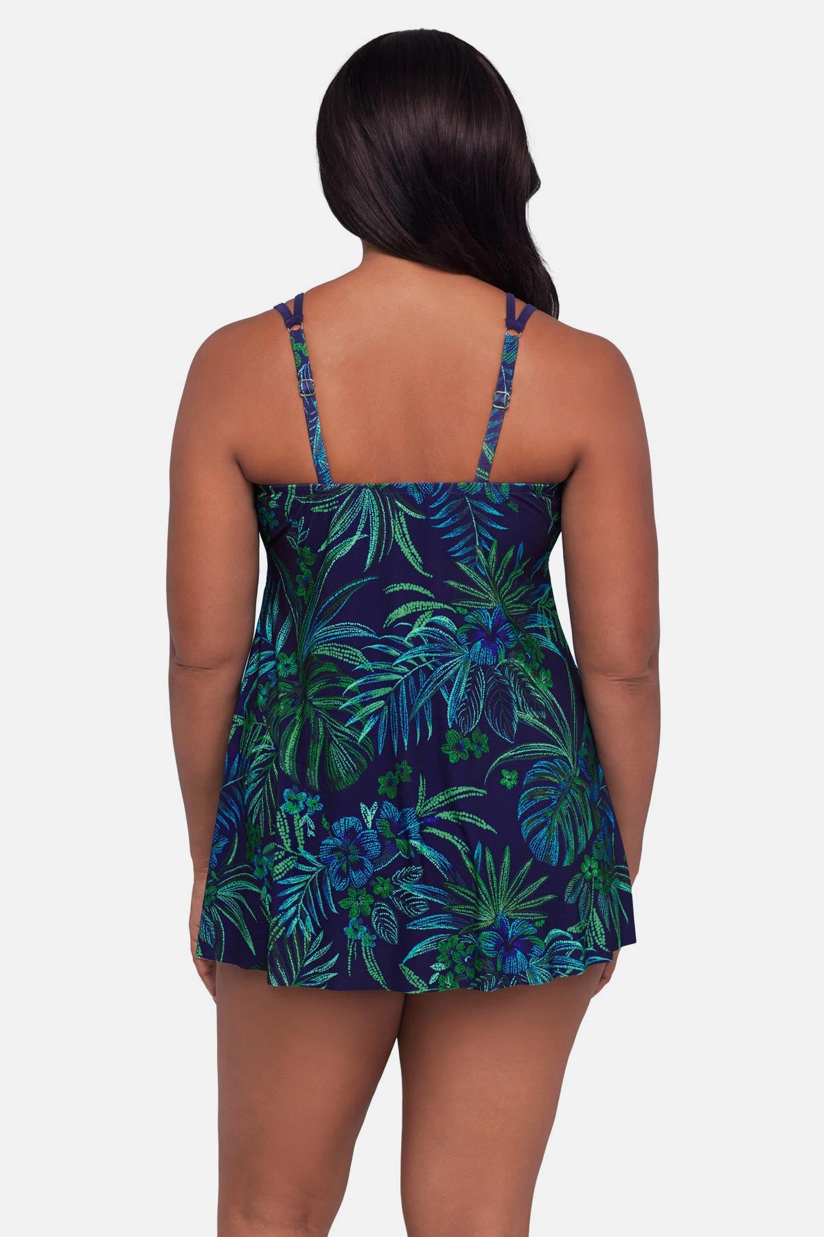 Woman turned away wearing a blue and green jungle printed swim dress
