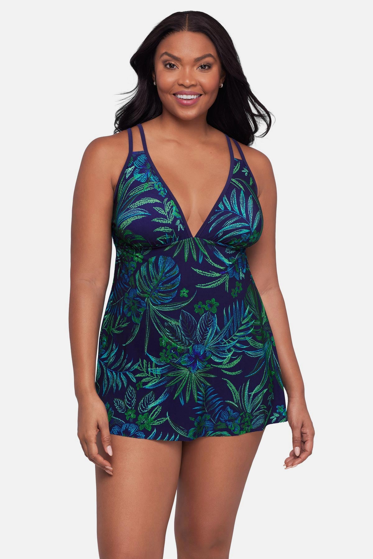 Woman wearing a blue and green jungle printed swim dress