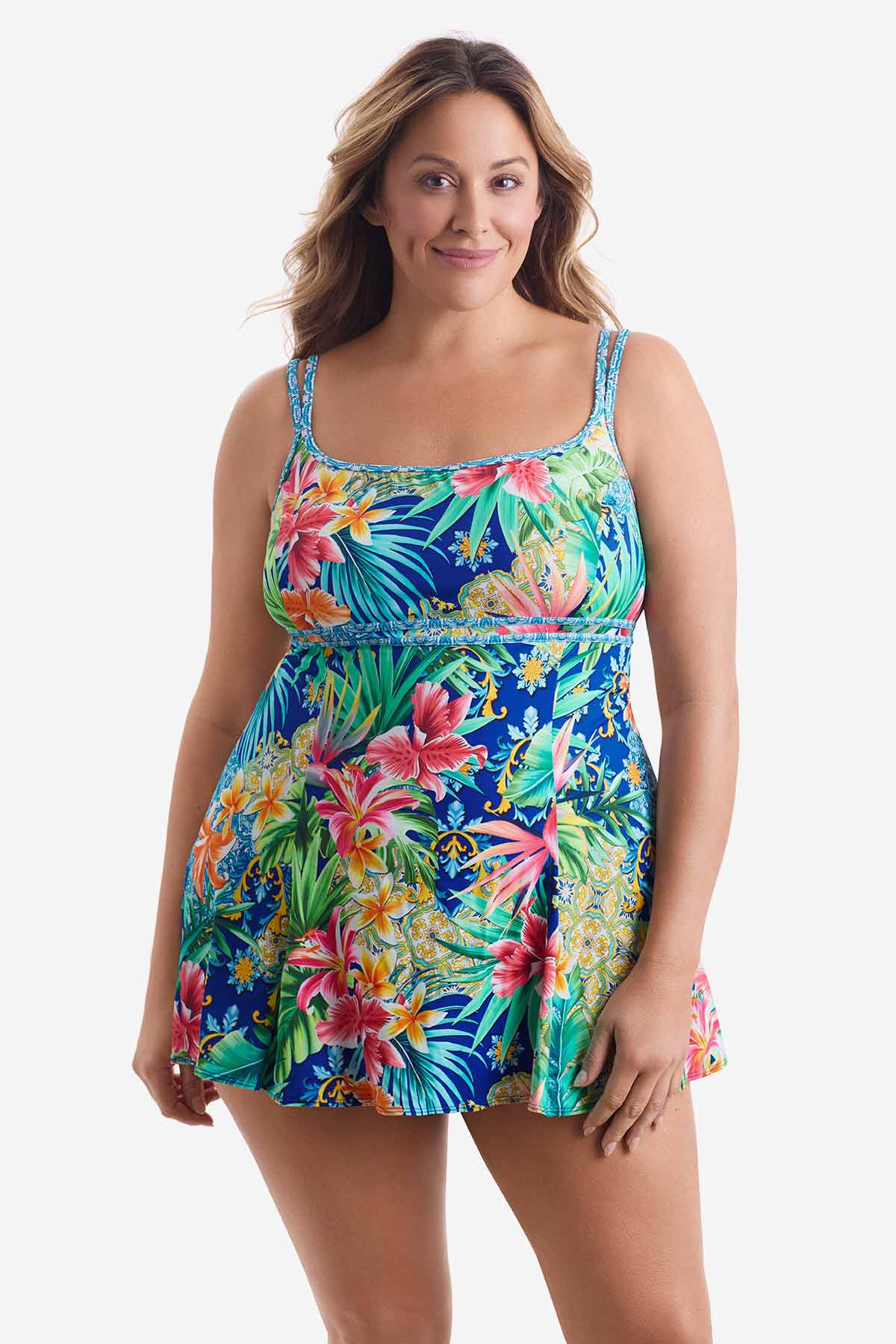 Woman wearing a multicolored swim dress with a palm leaf pattern