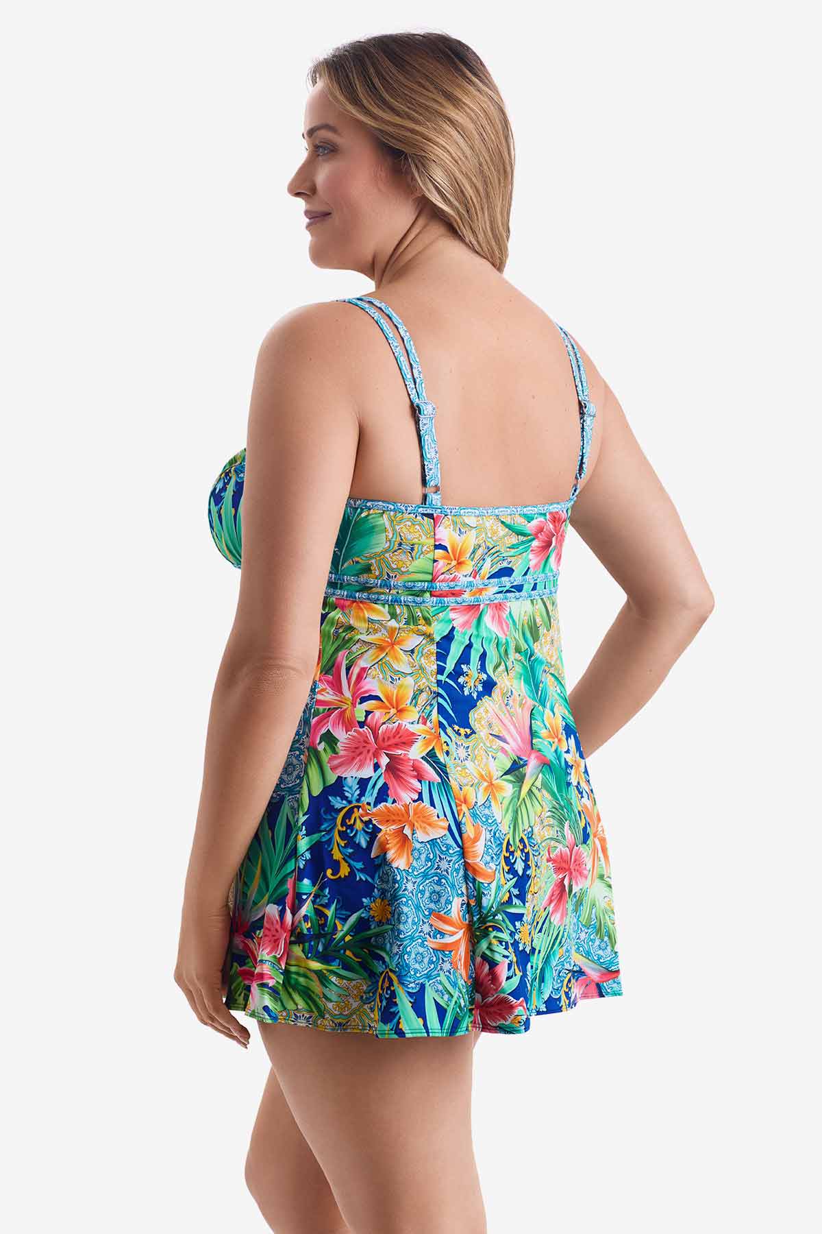 Woman turned left wearing a multicolored swim dress with a palm leaf pattern