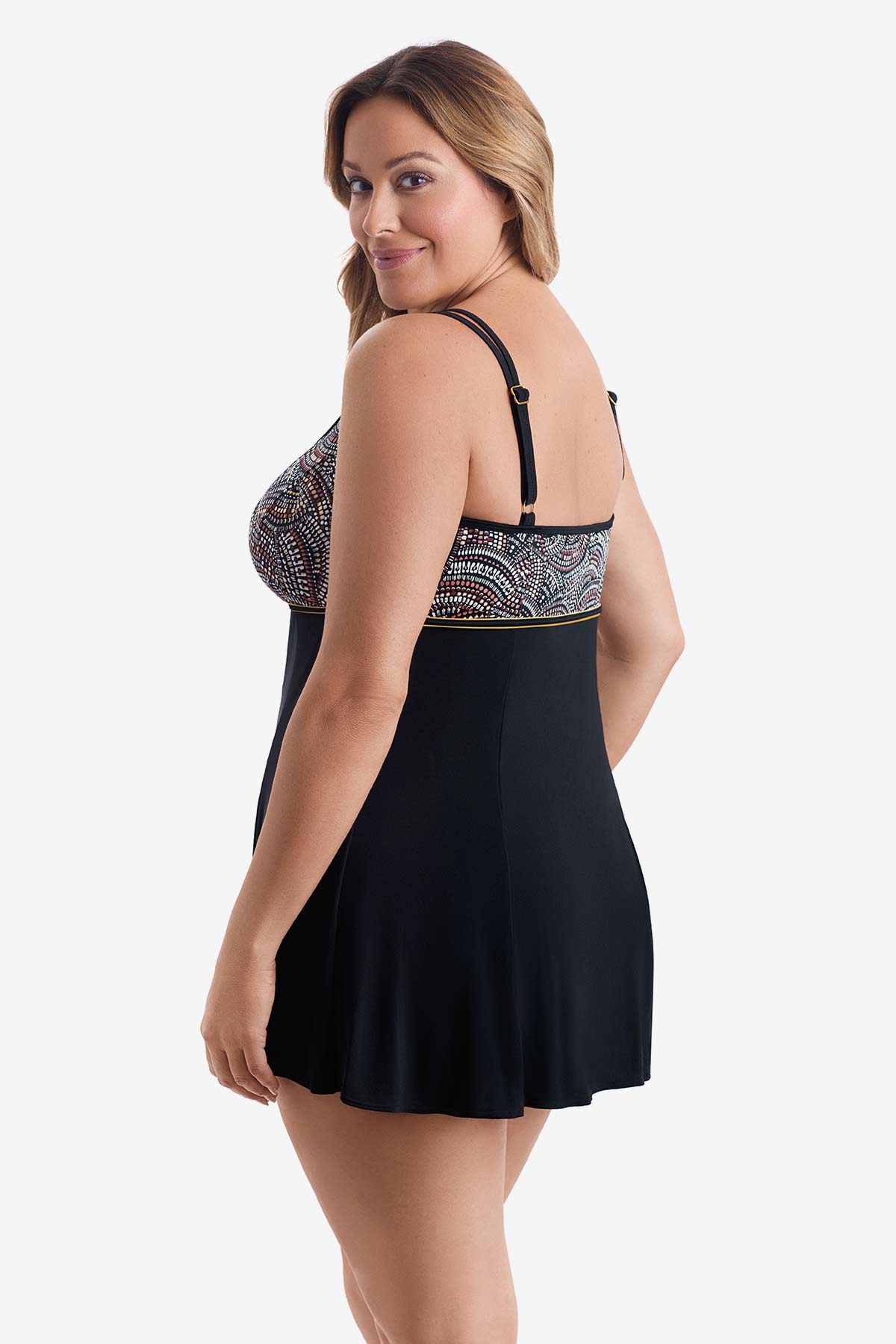 Woman turned left wearing a swim dress with multicolored dots on the bust