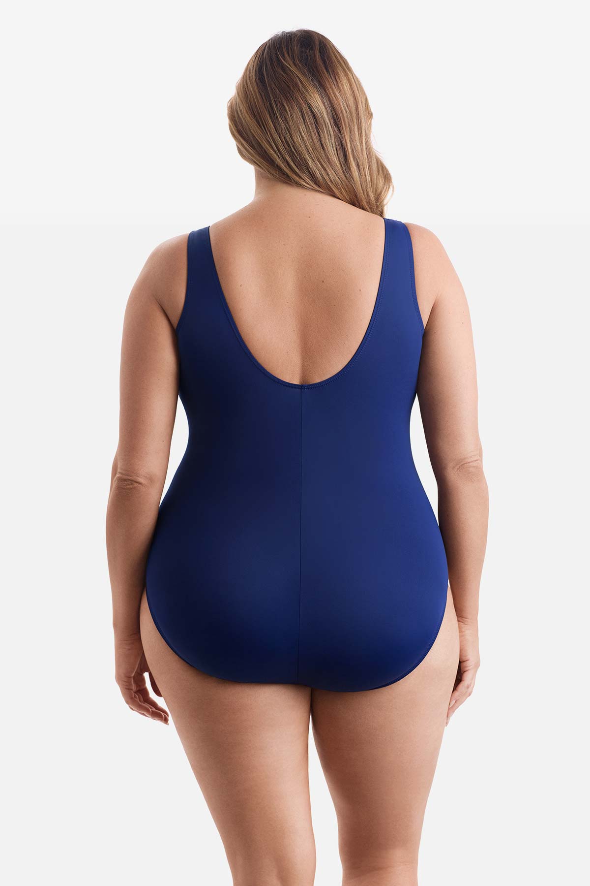 Woman faced away wearing a one-piece swimsuit