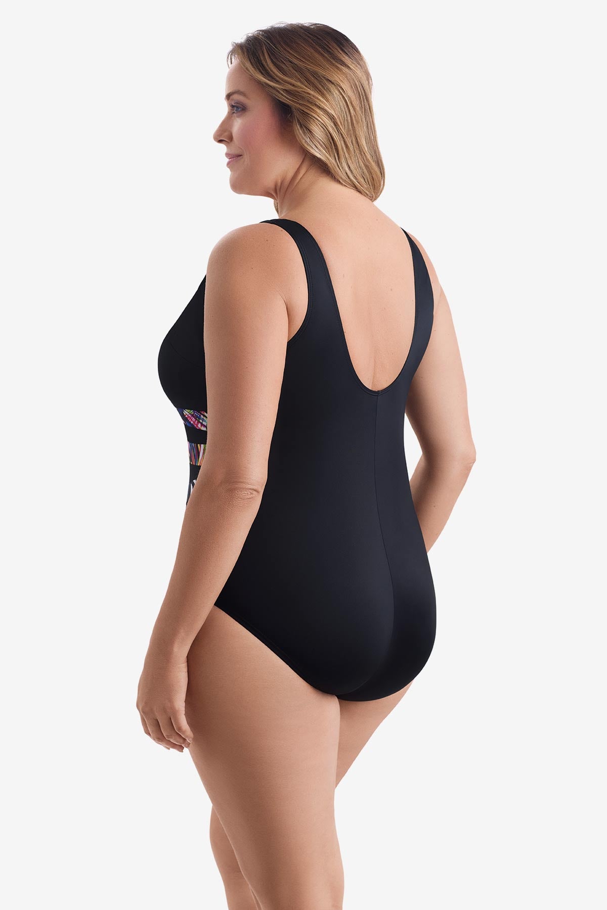 Woman faced left wearing a black one-piece swimsuit