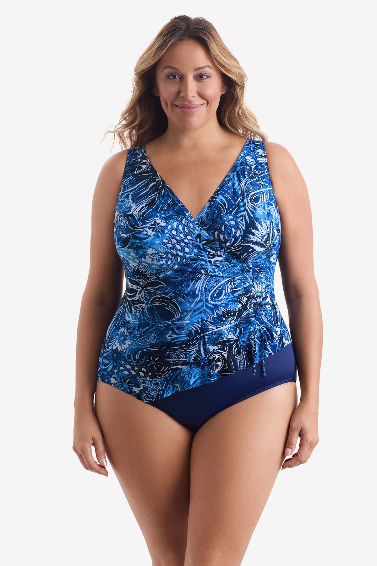 Woman wearing a blue abstract printed one-piece swimsuit