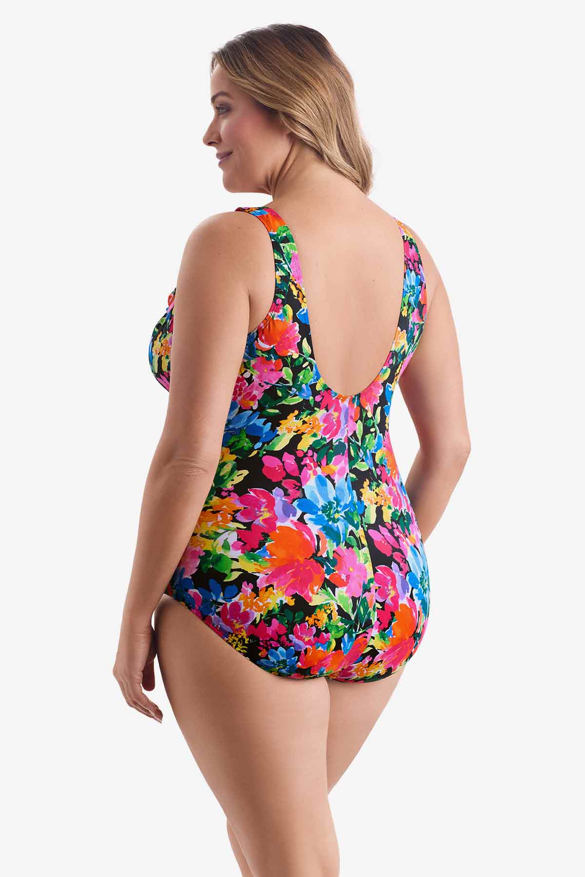 Woman turned left wearing a multicolored floral one-piece swimsuit