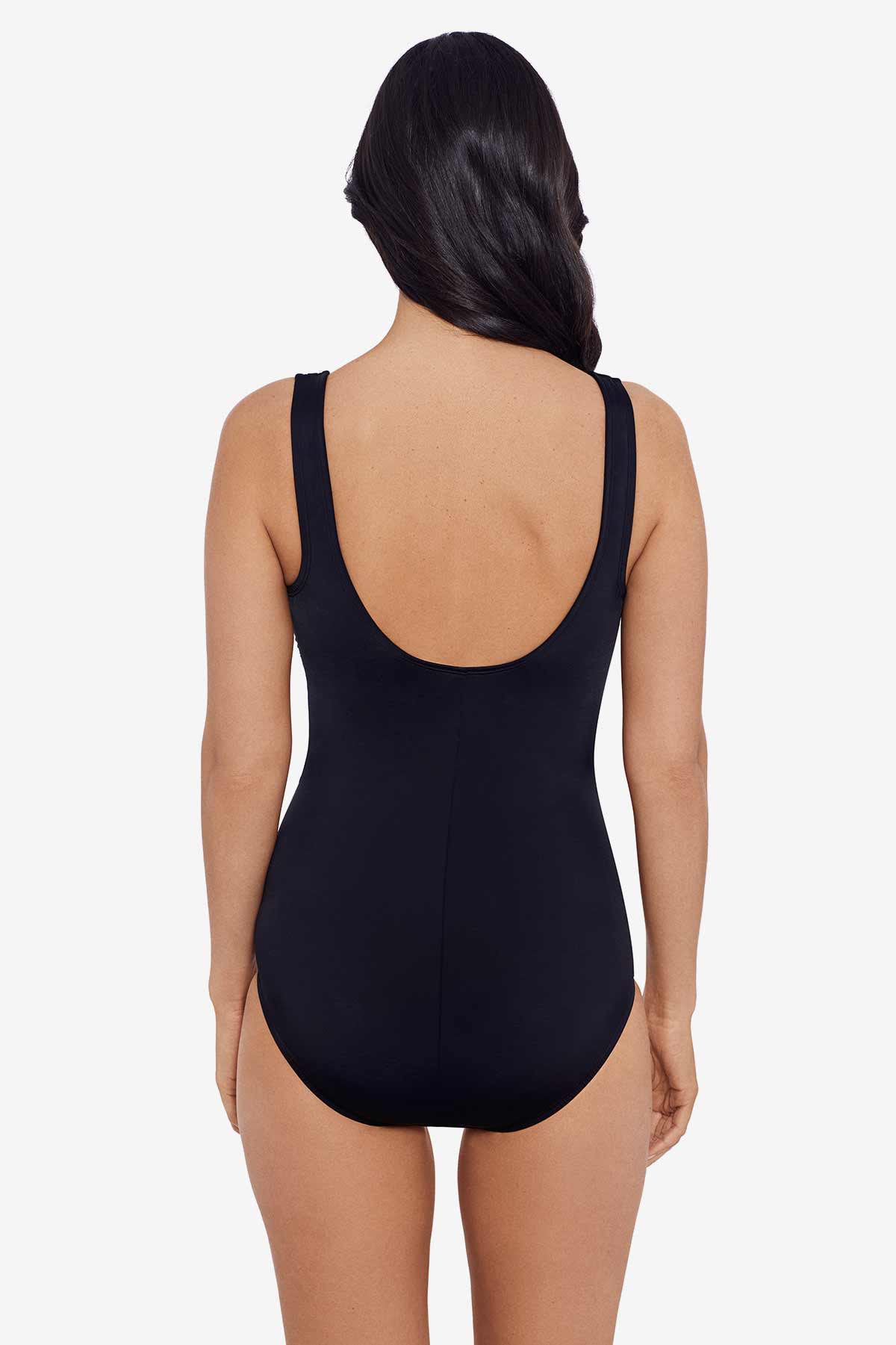 Woman turned away wearing a black one-piece swimsuit