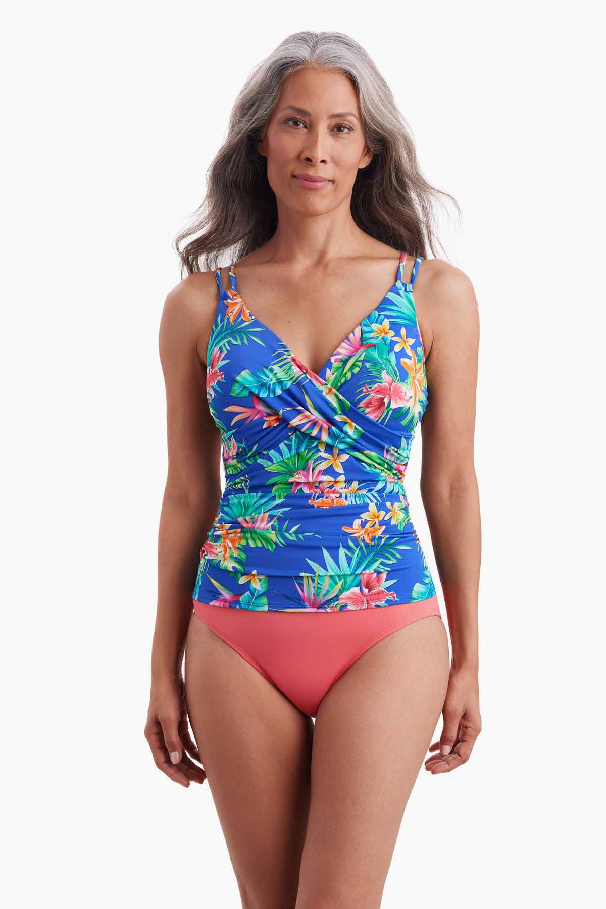 Woman wearing a tankini top with multicolor floral print