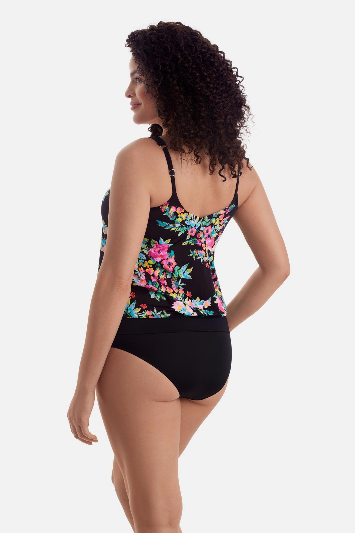 Woman turned left wearing a multicolored floral printed blouson tankini top