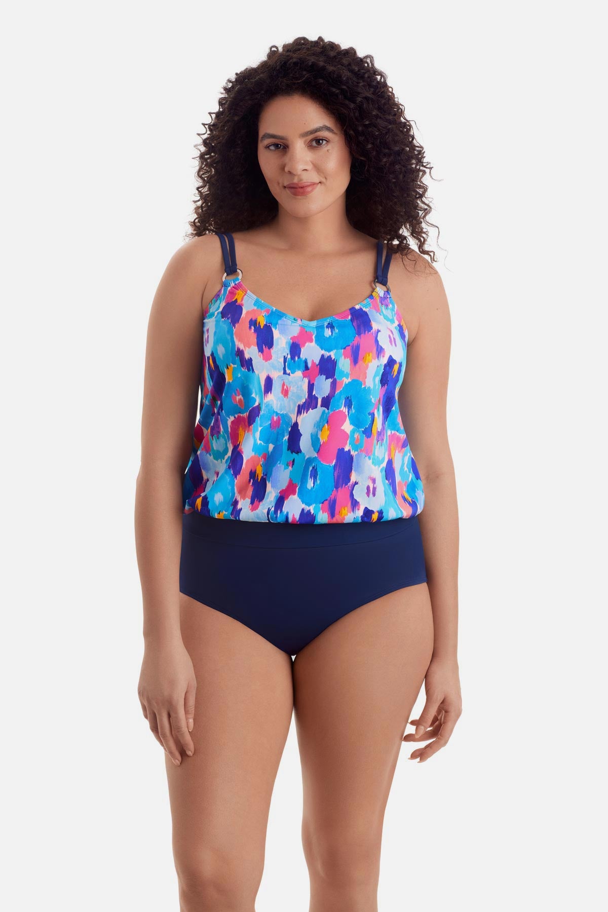 Woman wearing a multicolor abstract print blouson tankini top