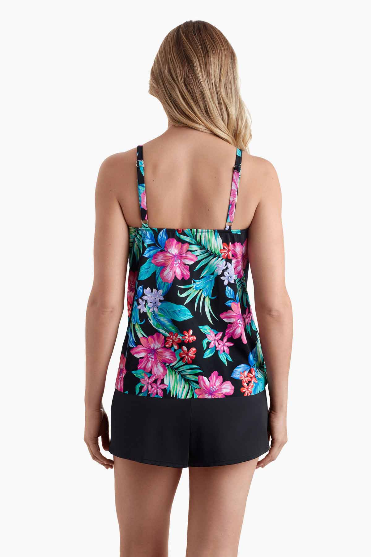 Woman faced away to show off multicolored floral print of tankini top