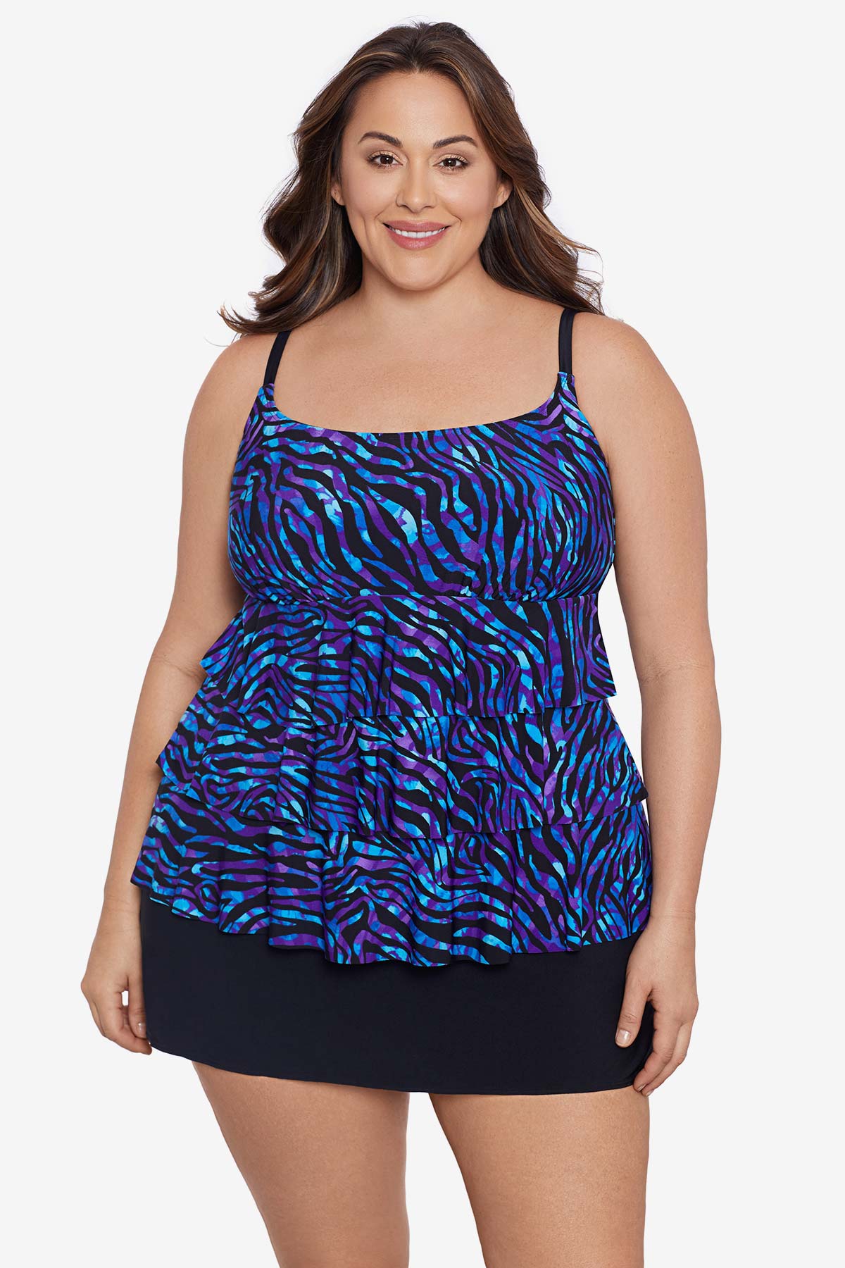 Woman wearing a blue animal-esque printed ruffle skirtini swimsuit
