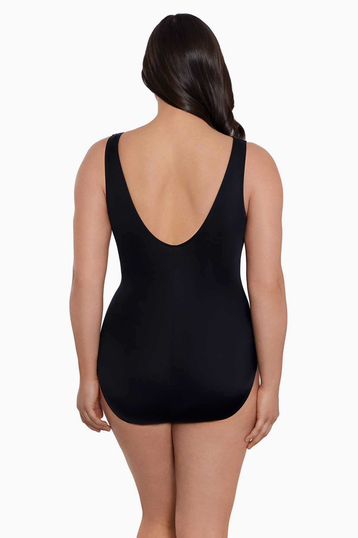 Woman turned away wearing a black one-piece swimsuit