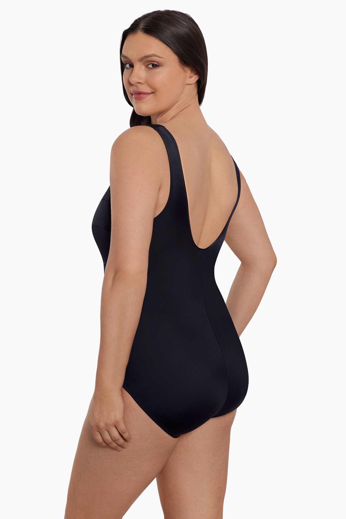 Woman faced left wearing a black swimsuit with blue streaks down the front